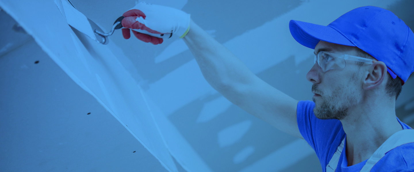 man touching up drywall Oregon City OR 1